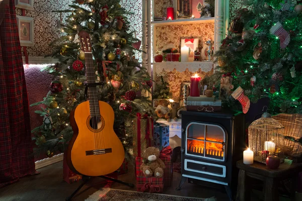 Classic guitar in cristmas interior — Stock Photo, Image