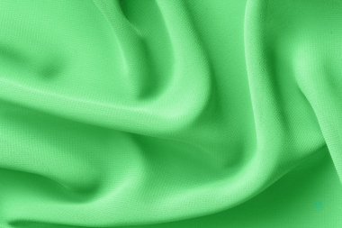 ışık yeşil kumaş kıvrımları arka plan ile