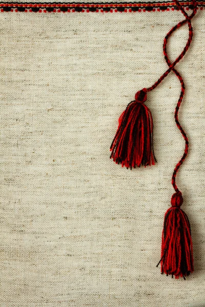 Fabric with embroidered trim and tassels — Stock Photo, Image