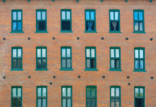 Apartments in old shop brick and windows wall facade architecture