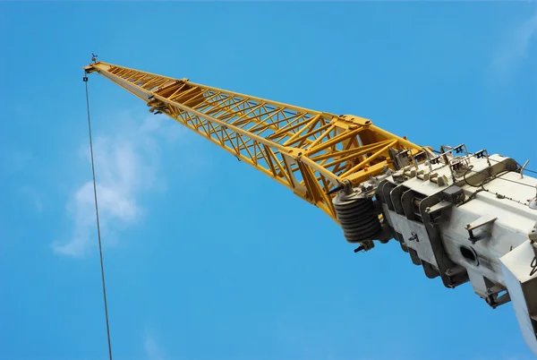 Yellow crane on blue sky — Stock Photo, Image