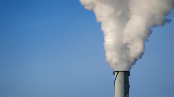 Smoke on blue sky, industrial chimney pollution — Stock Video