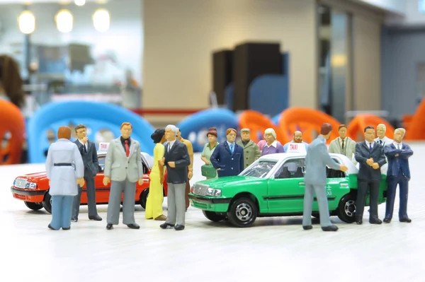 model taxi and small figures