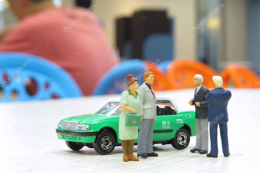 model taxi and small figures