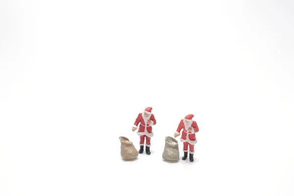 Два Санта Клауса Рисуют Подарочный Мешок Доски — стоковое фото