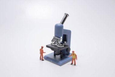 a mini of worker with the Microscope