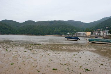 Sheung Sze Wan Sahili 'nde tekne ve deniz. hk 15 Nisan 2006 