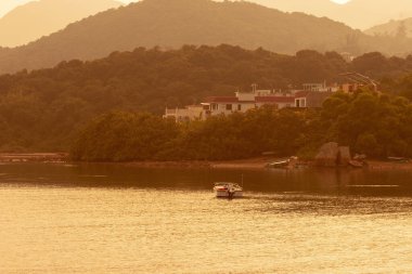 10 Sept 2006  luxury area in Sai Kung.  Yacht docking near coast, daytime.