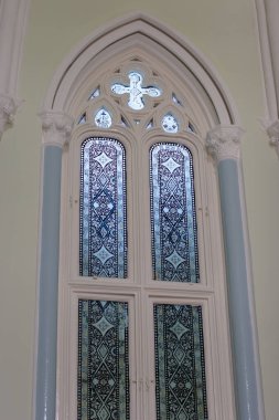 21 Oct 2006 Old window with stained glass on facade of the building