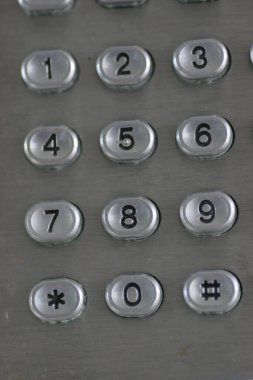 close up of the public phone Numbers and button