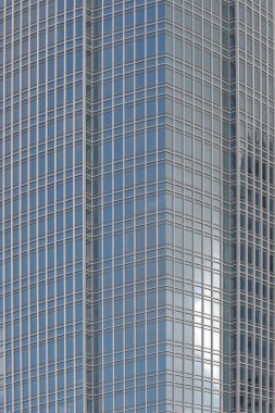 the contemporary glass skyscraper reflecting the blue sky 15 May 2005