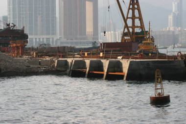 15 may 2005 Excavator on the reclamation land. hong kong