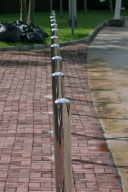 the grass on the brick walk way brick for footpath , brick walk way