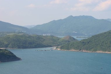 22 May 2005  green islands surrounded by the blue ocean. Port Shelter