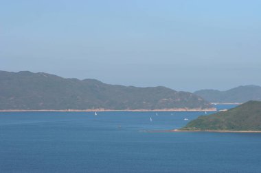 22 May 2005  green islands surrounded by the blue ocean. Port Shelter