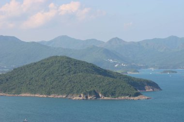 22 May 2005  green islands surrounded by the blue ocean. Port Shelter