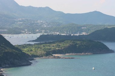 22 May 2005  green islands surrounded by the blue ocean. Port Shelter