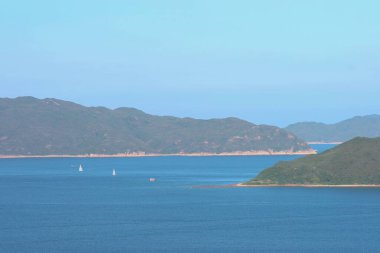 22 May 2005  green islands surrounded by the blue ocean. Port Shelter