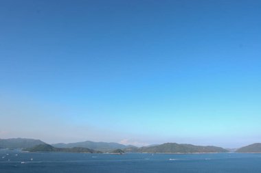 22 May 2005  green islands surrounded by the blue ocean. Port Shelter