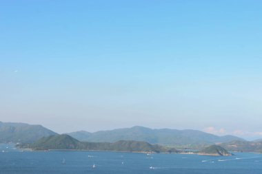 22 May 2005 located at Port Shelter , Beautiful green islands surrounded by the blue ocean.