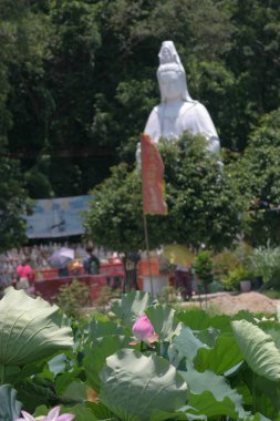 a Buddha with Lotus Flower and Bamboo leaves