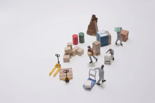 Uma Figura Trabalhador Mini Mover Produtos — Fotografia de Stock