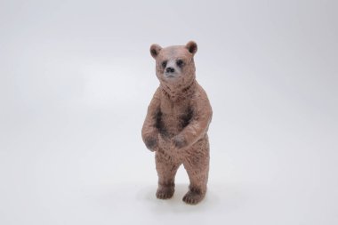 Miniature figure of a toy bear, isolate on a white background. 