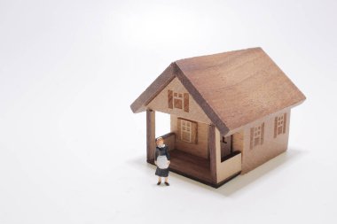 mini Beautiful chambermaid in uniform with house