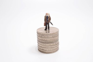 Travel, saving, planing concept,  mini figures with backpack stand