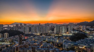 Evening cityscape of Kowloon skyline during twilight