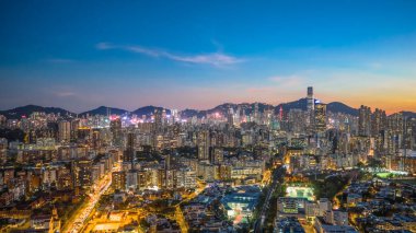 Evening cityscape of Kowloon skyline during twilight