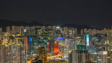 Evening view of Kowloon Bay urban waterfront skyline