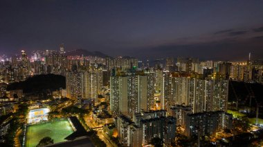 Public housing estate glowing under urban night lights