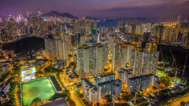Public housing estate glowing under urban night lights