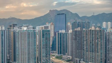 Scenic Kai Tak waterfront promenade with modern city skyline Dec 14 2025