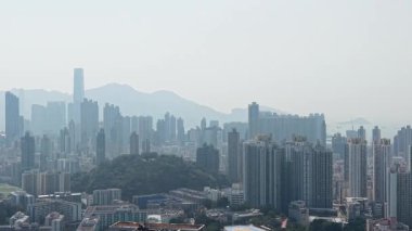 Bright Daylight Illuminates Dense Urban Skyline Across Middle Kowloon Jan 15 2026
