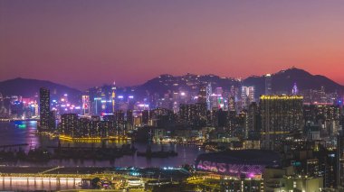 Modern residential towers overlook calm waters and bustling shoreline Feb 15 2026