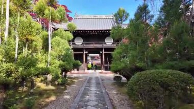 Traditional Japanese Genkoan Architecture with Vibrant Red Autumn Maple Leaves and Large Glass Windows, Nov 24, 2025