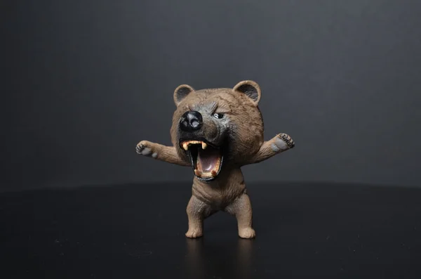 Brinquedo urso de plástico no fundo — Fotografia de Stock