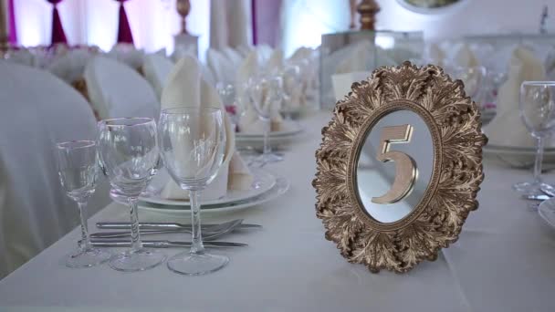 Set it on a table plate with the number 5 — Stock Video