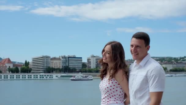 Man and a Woman Walk Along the Waterfront — Stock Video