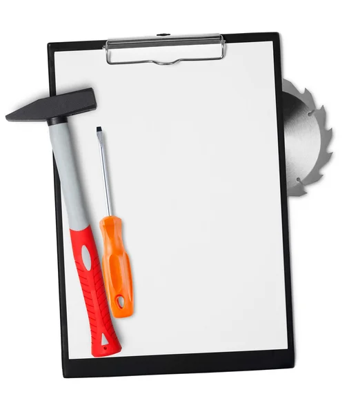 Hammer and screwdriver on clipboard — Stock Photo, Image