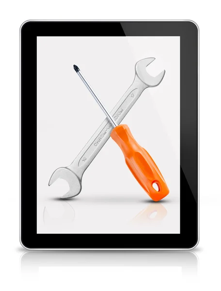 Screwdriver and wrench on tablet — Stock Photo, Image