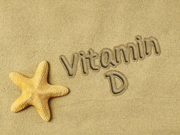 Vitamin D auf Sand — Stockfoto