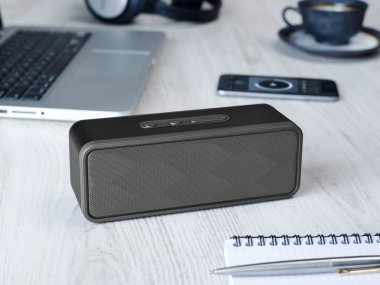 Wireless speaker on a table clipart