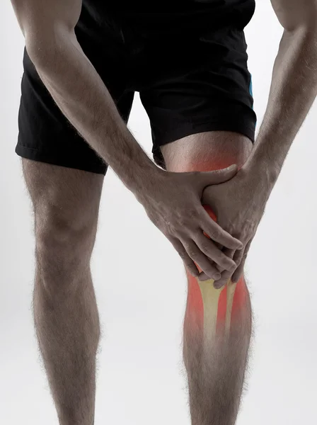 Knee pain on gray — Stock Photo, Image