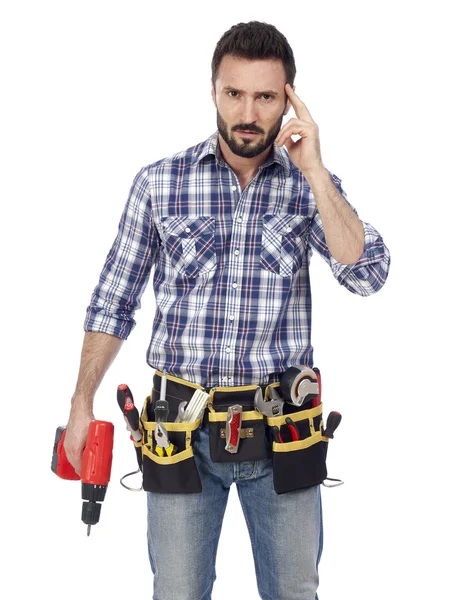Handyman med toolbelt och drill — Stockfoto