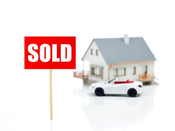 Sold sign in front of house — Stock Photo, Image
