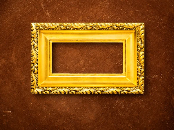 Quadro dourado no fundo grunge — Fotografia de Stock