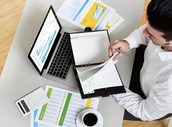 Business man working on financial issues — Stock Photo, Image